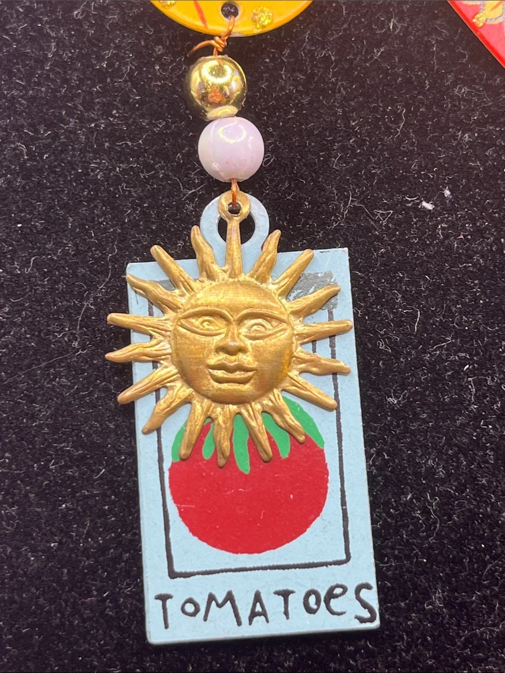 Signed Rossi flying lady stick pin brooch with a tomato sign